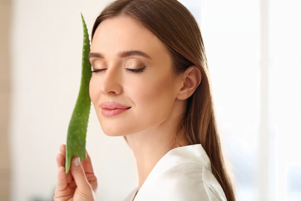 Women Holding Aloe Vera Leaf Near Face